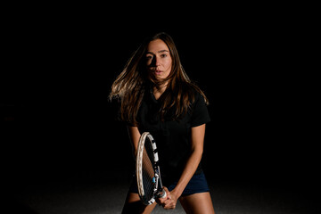 portrait of beautiful young caucasian woman with rocket in her hand to playing tennis.