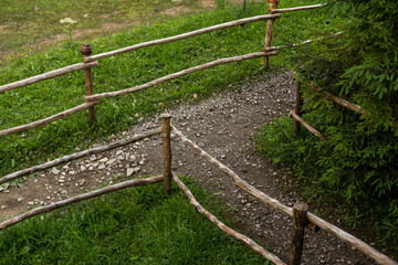 View of clay jug on wicker fence