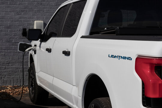 Ford F-150 Lightning display. Ford offers the F150 Lightning all-electric truck in Pro, XLT, Lariat, and Platinum models.