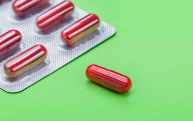 Tablets. Medicine. The science. Pills for diseases on a green background.