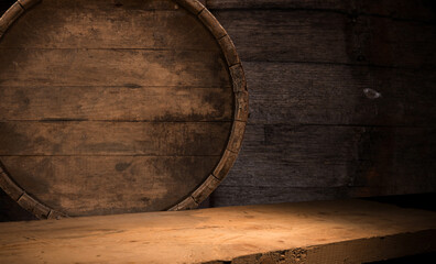 Wooden barrels with whiskey in dark cellar. High quality photo