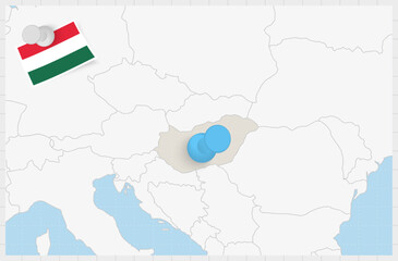Map of Hungary with a pinned blue pin. Pinned flag of Hungary.