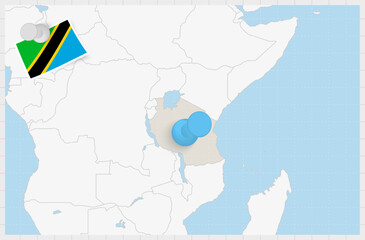 Map of Tanzania with a pinned blue pin. Pinned flag of Tanzania.