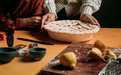 Baking together in the kitchen making a pie 