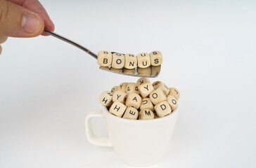 In a cup there are cubes with letters, on a spoon there are cubes with an inscription - Bonus