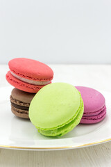 Delicious sweet light macaron dessert. Round multicolored pie.