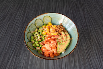 a fresh poke with salmon on a bowl