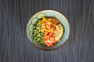 a fresh poke with salmon on a bowl