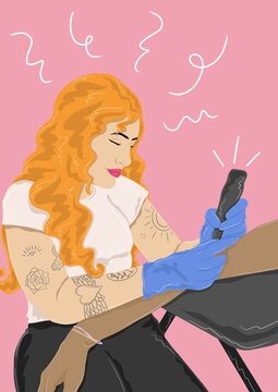 woman tattooing an arm