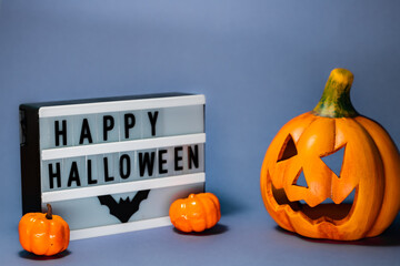 Happy Halloween sign with jack-o-lantern decorations