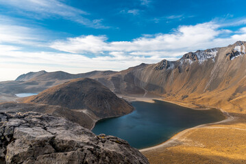 View inside of Volcano Nevado de Toluca National park with lakes inside the crater in Mexico in the morning blue sky - landscape near of Mexico City - Xinantecatl