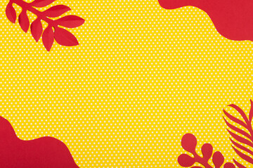 yellow polka dot background with red and white paper flowers