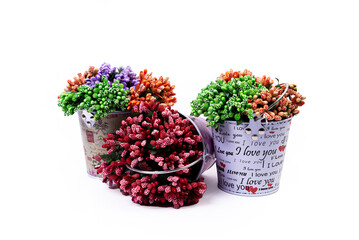 aluminum ice bucket laid in wait for use. stainless multi-colored bucket with green blue flowers