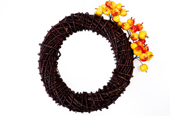 Wreath woven from the branches of the vine isolated , Place for text