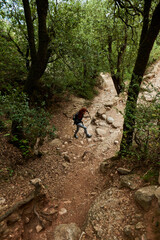 Distant backpacker on her way