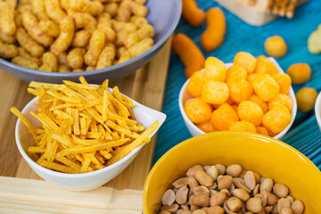 Beer salty snacks on wooden table