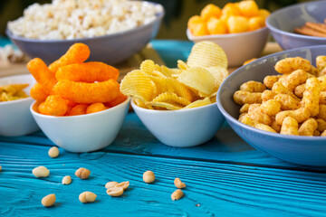 Beer salty snacks on wooden table