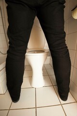 urination on a toilet in a restroom