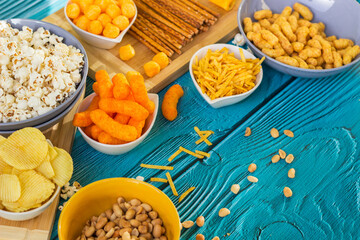 Beer salty snacks on wooden table