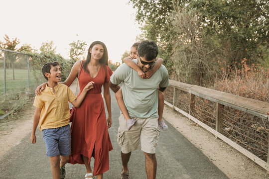 Family walking together with Dad outdoors 