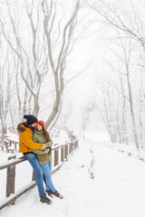 Couple spending snowy winter day outdoors
