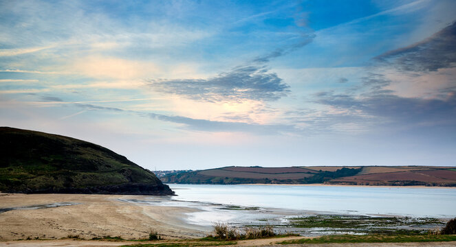 The beach at Daymer Bay at Trebetherick in Cornwall under a blue sky