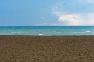 Travel vacation background concept on empty beach in Samandağ, Antakya, Hatay. Beautiful scene of blue sky and clouds. Copy space for text.