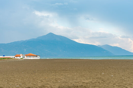 View of the 14 km long Cevlik beach with the Mount Kilic and beautiful blue sky at the background in Samandag, Antakya, Hatay. Copy space for text. 