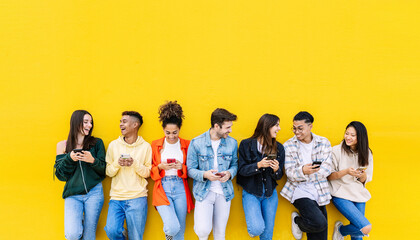 Multiracial young friends having fun sharing media content on mobile phone - Millennial diverse...