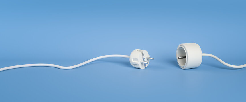 Blackout or disruption concept: Separated Plug and Socket in white.lying on a blue background