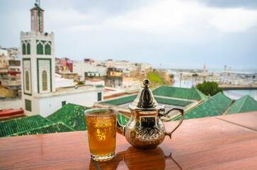 Traditional Moroccan mint tea and panorama of old medina in city Tangier, Morocco - 540824096
