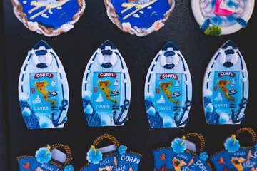 View of traditional tourist souvenirs and gifts from Kerkyra, Corfu island, Ionian sea, Greece, fridge magnets with text 