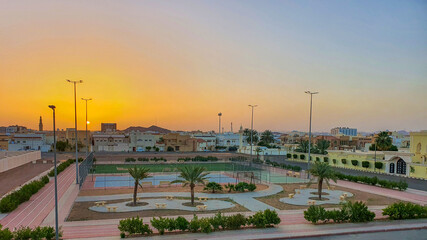 Fototapeta na wymiar District, Public Park, Hail, Saudi Arabia. 03.20.2022. A shot of public park in Hail at sunrise time.