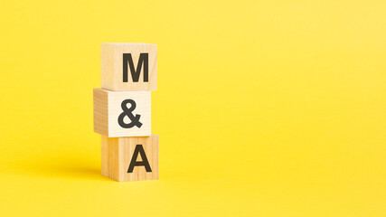 m and a symbol. beautiful yellow background. business concept. copy space.