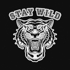 Vector illustration of a tiger's head in the style of a traditional tattoo for clothing and other purposes