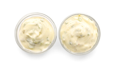 Delicious Caesar sauce in glass bowls on white background