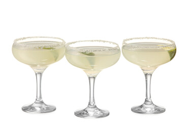 Glasses of tasty margarita cocktail on white background