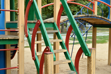 Wooden stairs on children's playground in public park