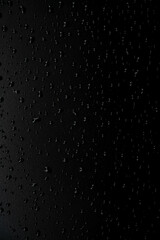 Water droplets on the floor with black background