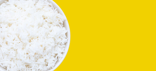 Dish of rice on yellow background.