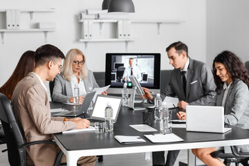 Business people having online meeting in office