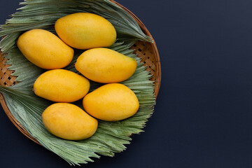 Tropical fruit, Mango on dark background.