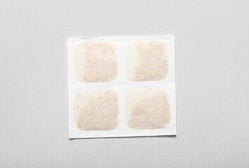 Mustard plaster on grey background