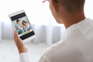 Family psychologist video chatting with patients in bedroom