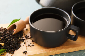 Cup of black tea on table, closeup