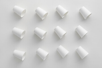 Pattern made of paper cups on white background