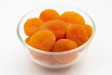 Dried apricots on white background.