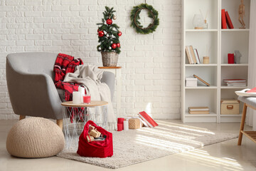 Stylish interior of living room with Santa bag and gifts