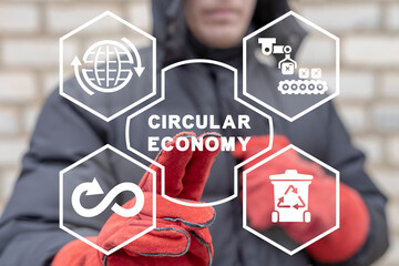 Industrial engineer using virtual touchscreen presses inscription: CIRCULAR ECONOMY. Circular...