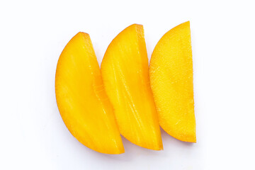 Mango fruit slices on white background.